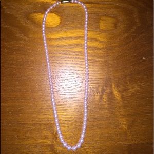 Pink pearl necklace.